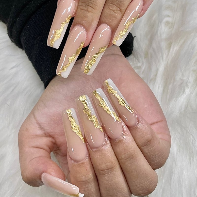 Elegant nude nails with white tips and gold detail